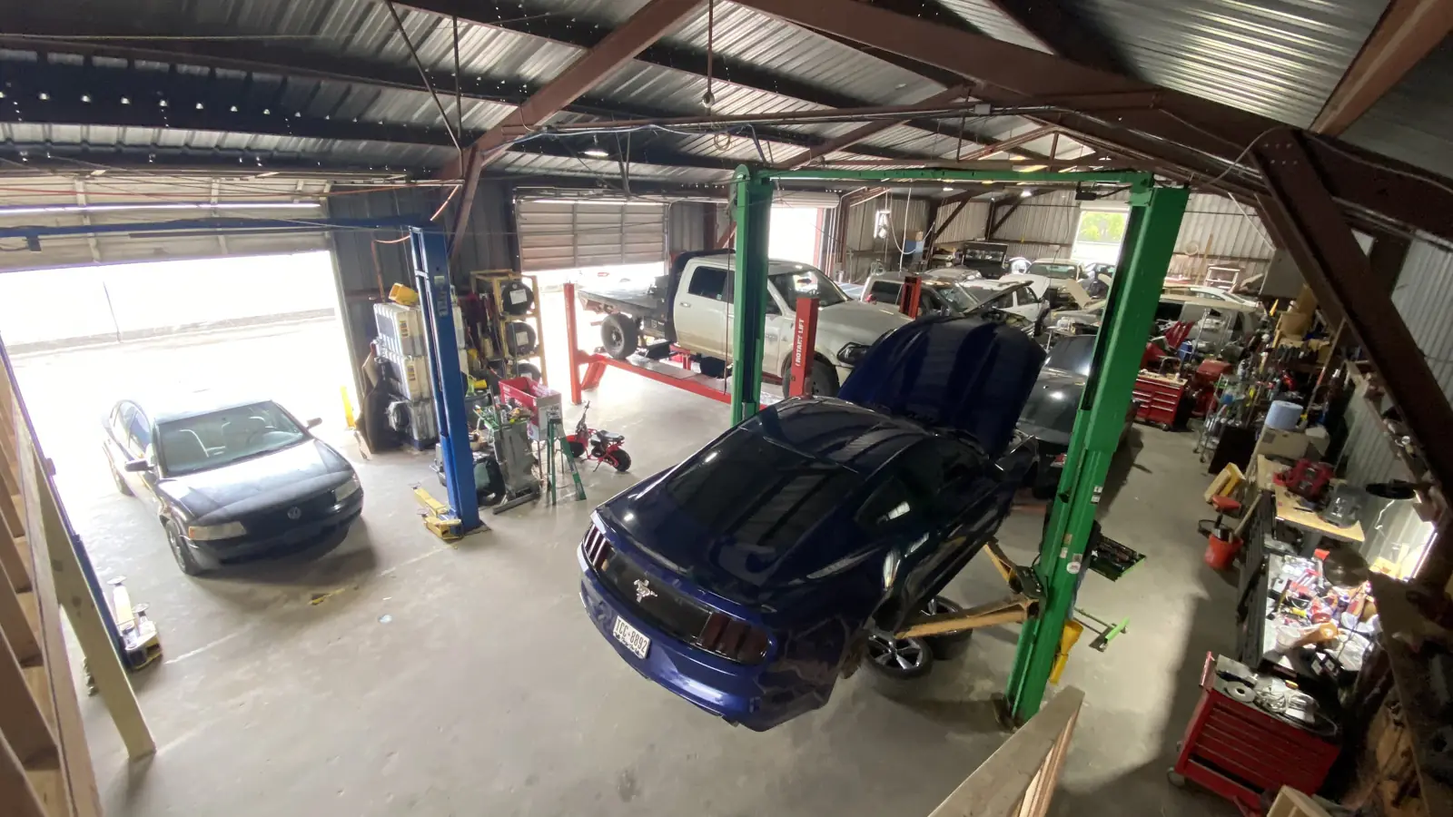 Cars on the lifts inside R&E Auto Repair