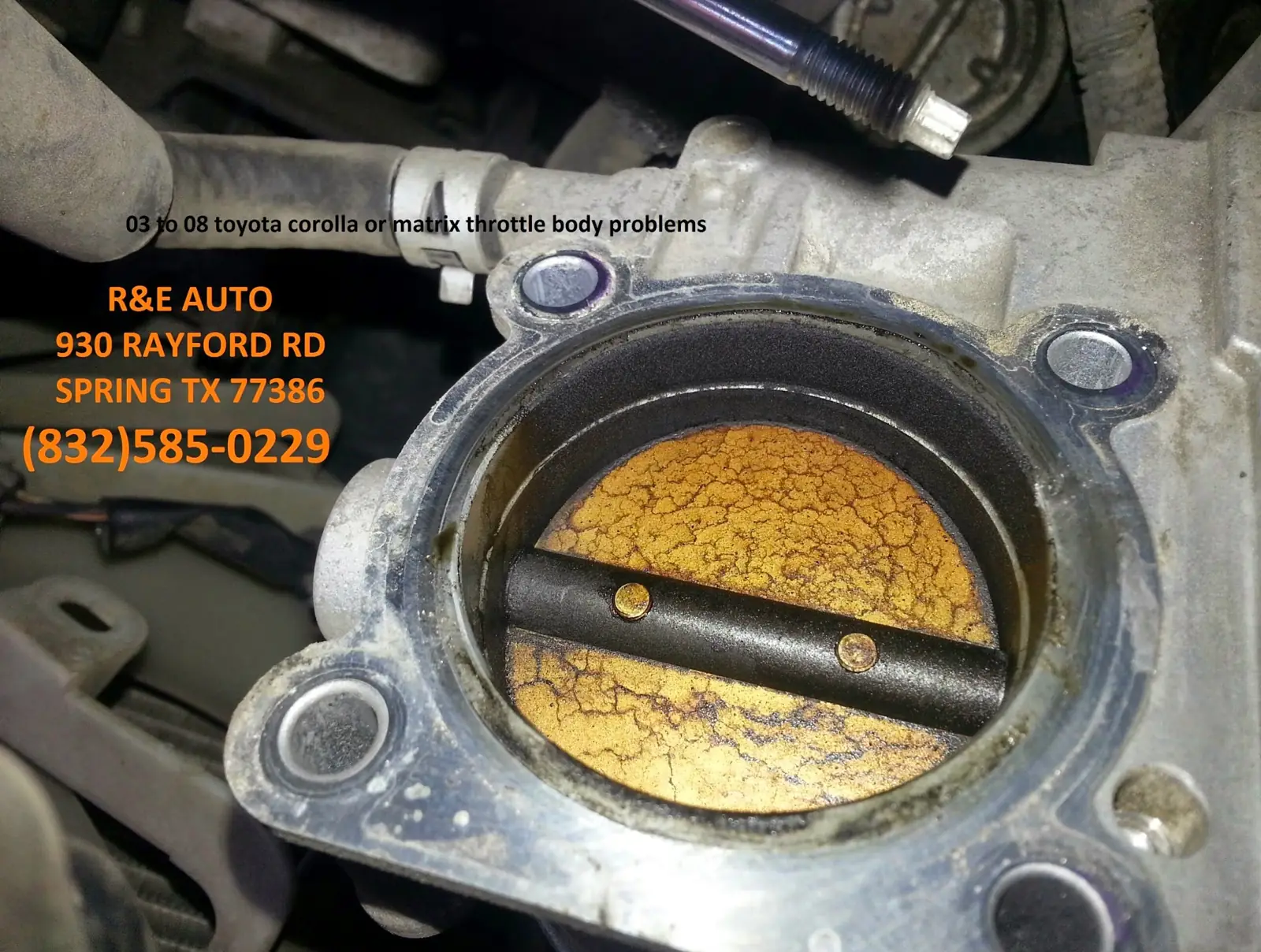 A throttle body with carbon buildup before cleaning