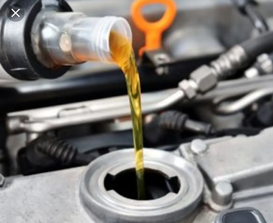 Fresh oil being poured into an engine