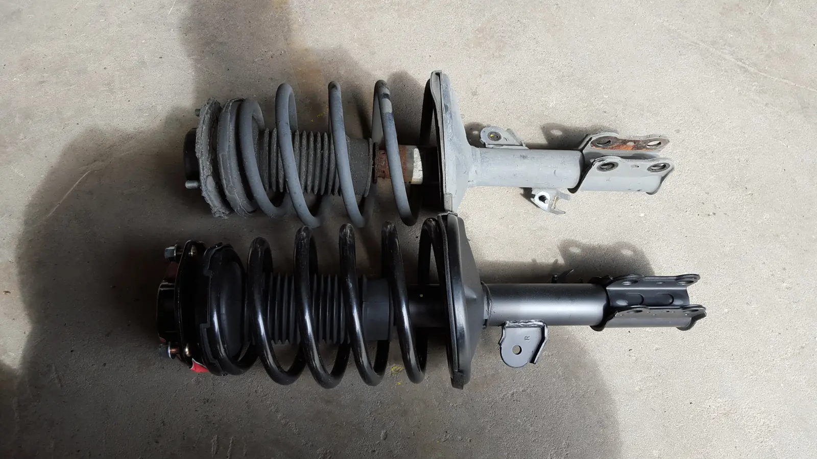 Old and new strut assemblies side by side
